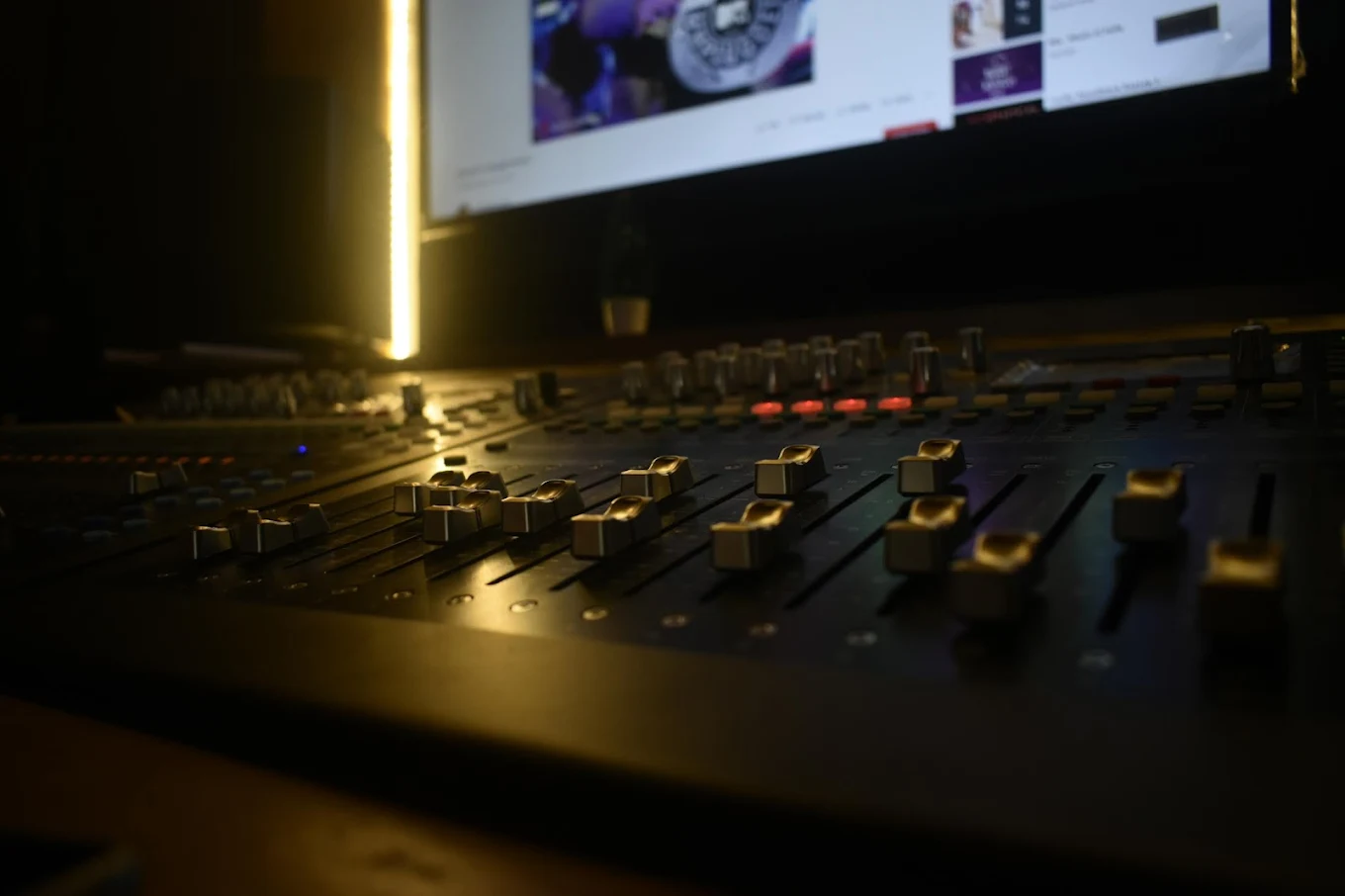 Close-up of live sound mixer controls