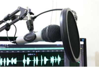 image of a mic and computer screen used for Voice recording